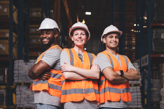Workers smiling in a warehouse